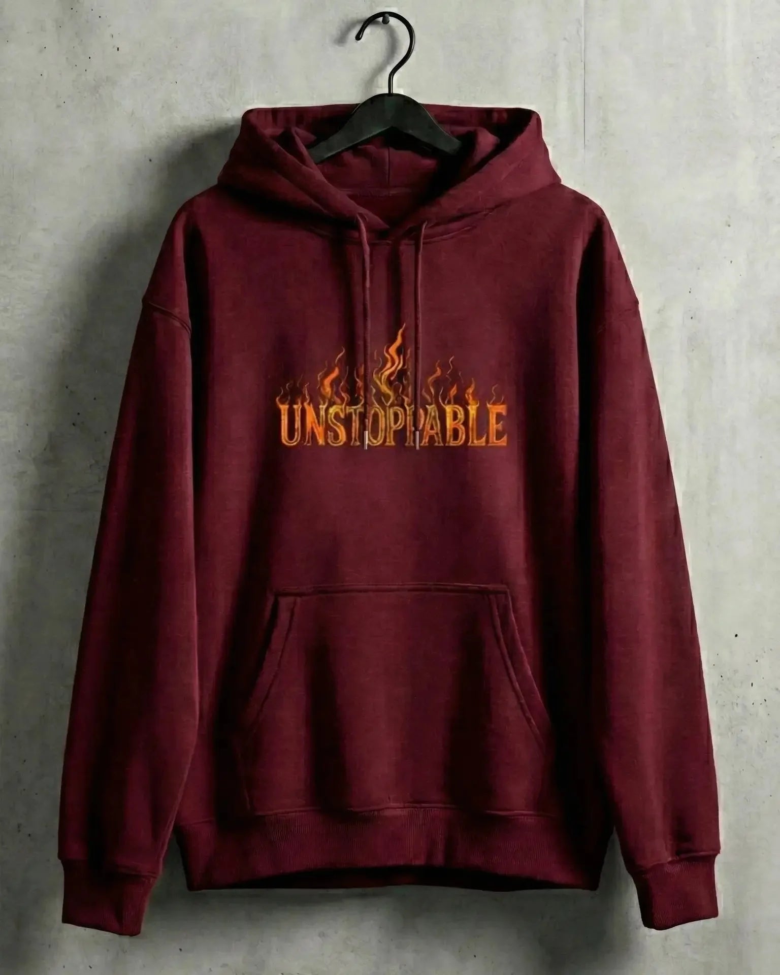 Maroon hoodie with 'Unstoppable' text on a gray textured background